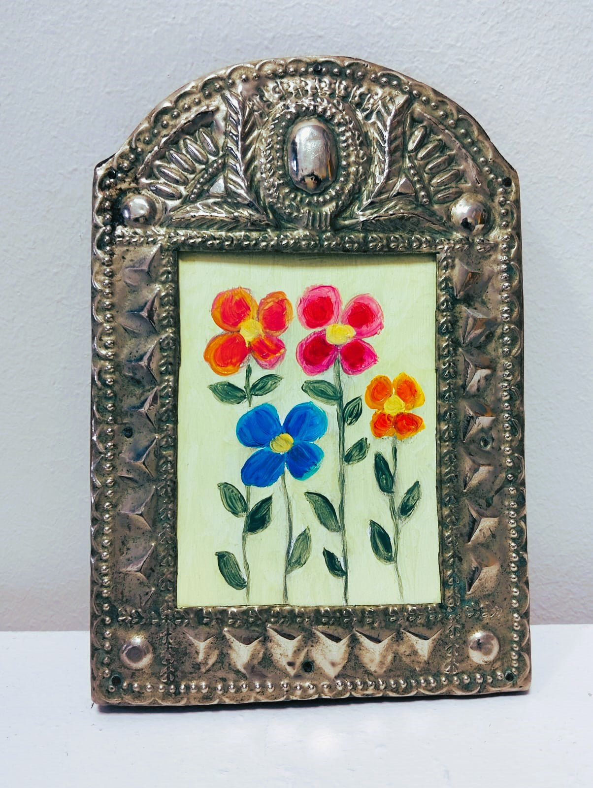 Cuadro con marco repujado